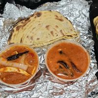 Vegan butter & Kadai chicken, parantha bread, & app platter at Ambrosia India Bistro in Monterey