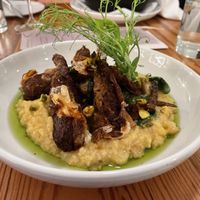 Smoke Sausage with Grits  at The Green House in Wilmington