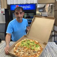 We asked the owner, Giuseppe for a picture with our pizza!  at Toto's Pizzeria in Philadelphia
