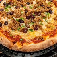 VEGAN Pizza with vegan cheese, vegan sausage, green peppers, onions, and kalamata olives! at Sergio's in Midlothian