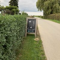 Sign indicating the ice cream shop, parking spot just around the corner at Gelato Farm Teuven in Voeren