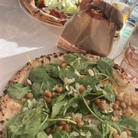 Lebanese pizza, hummus based with roasted chick peas, red onions, spinach etc  at Luigia in Meyrin