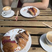 Oat milk cappuccinos and berry, chocolate n Cherry croissants at Massolit Books & Café in Krakow