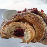 croissant with cherry filling at Massolit Books & Café in Krakow