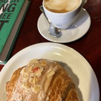 Oat cappuccino and almond croissant   at Massolit Books & Café in Krakow