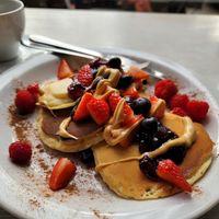 Pancakes with peanut butter and jam (no maple syrup) at Massolit Books & Café in Krakow