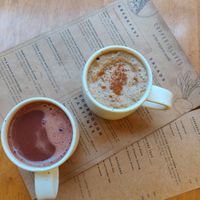 Vegan hot chocolate and a cinnamon latte. The coffee is sourced from a nearby coffee estate.  at Copper + Cloves @ Organic World in Bangalore