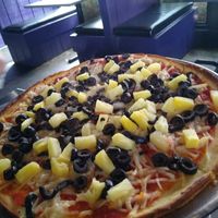 Gluten free crust with vegan cheese, black olives and pineapple at Lupi's Pizza Pies in Chattanooga