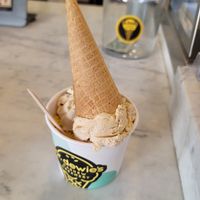 3 scoops with a cone on top at Mr.Dewie's Cashew Creamery in Oakland