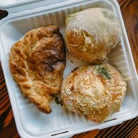 Pesto pastry, pizza pastry, and potato and cheese empanada  at Timeless Coffee - Webster in Oakland