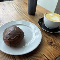 Chocolate jelly-filled donut and golden latte 😋   at Timeless Coffee - Webster in Oakland
