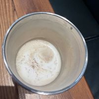 Pistachio cream latte in personal cup  at Timeless Coffee - Webster in Oakland