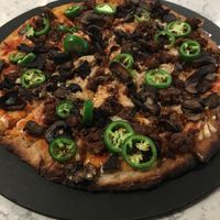 Create Your Own Stone Oven Pizza on cauliflower crust with Beyond Meat chorizo, mushrooms, jalapeños & plant-based mozzarella cheese. Individual (12”) is the perfect size. at Mason Jar Kitchen in Eagan