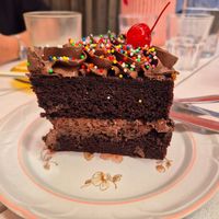 Someone's birthday cake: very pretty and moist but not much chocolate taste at Tyler's Milkbar in Preston