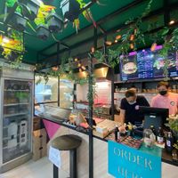 Interior with digital menu displaying burger and meal deal options at FunKink Burgers in Bucharest