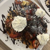Pancakes with banana, strawberry, whipped cream, chocolate syrup, Oreo crumble (vegan)  at Amy's Dejeuner Brunch & Gaterie in Dollard-des-ormeaux