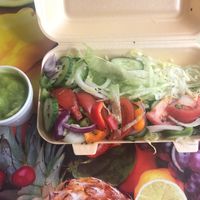 Side of mushy peas and a fresh side salad at Every Fish Bar in Harrow