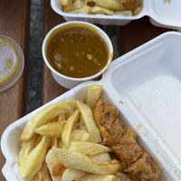Battered sausage and chips  at The Harbour Chippy in Newquay