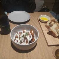 Patatas bravas y pan de masa madre con aceite de oliva at Ruda in Villacarriedo