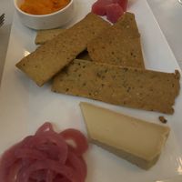 Cheese plate with homemade gluten free crackers at True Bistro in Somerville