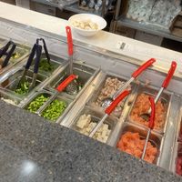 Counter where bowls are built  at Poké Fresh in Highland Heights