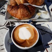 Cappuccino (soy milk) and chocolate croissant at Flower Park in Cagliari