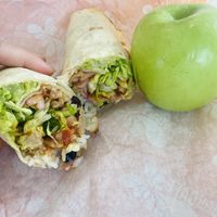 Plant-based chicken and no cheddar in my Baja wrap with an apple on the side!  at Tropical Smoothie Cafe in Jackson