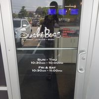Door with hours at Sushi Boss in Indianapolis