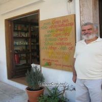 Stelios in front of his store at To Stachi in Crete