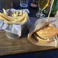 Vegan burger with fries and ketchup at MAD DUCK Burger & Pizza bar in Nin