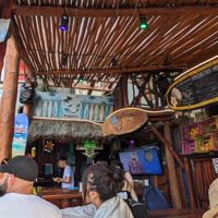 View of the restaurant, no indoor seating, but a few covered outdoor tables. at The Surfin Burrito in Cancun