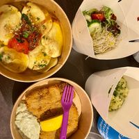 Schnitzel, ravioli and some sides (potato salad, some other greens/salad) at Max Pett in Munich