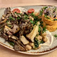 Grilled king oyster mushrooms on cashew tahini cream with sautéed dandelion, white beans and sweet potato puree 😍  at Max Pett in Munich