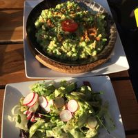 Vegan Käsespätzle with salad. at Max Pett in Munich