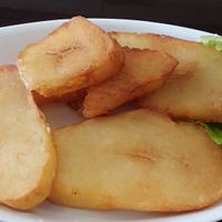 A side of golden potatoes at Aji Limon in Naples