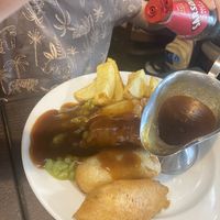 Battered sausage, chips, mushy peas and gravyy  at The Queen Inn in Cwmbran