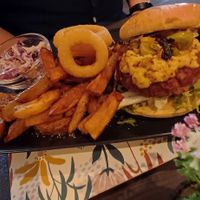 Lamb burger with chips and onion rings at The Queen Inn in Cwmbran