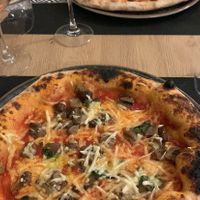 Red garlic marinara (top) and mushroom pizza with vegan cheese (bottom)  at Bella 'Mbriana in Sulmona