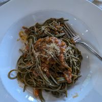 Spaghetti Spirulina with soy ragu at L'M Ristopizza in San Pantaleo