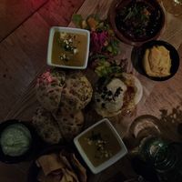 Vegan shared platter. Maissoup, flamkuchen, pumpkin hummus, vegan steak tartar, bread and vegan aioli. at The Old Pal in Zoetermeer