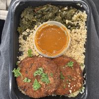 crab cakes with quinoa and collard greens and sauce 🤤  at Beyond Vegan Eats in Los Angeles
