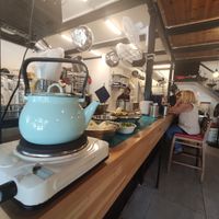 Help yourself to black coffee at Humus Nechama in Haifa