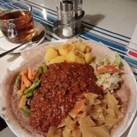 I think this is called "Misir Wot", lentils & mixed vegetables served with injera bread, yum! at Äthiopisches Restaurant in Vienna