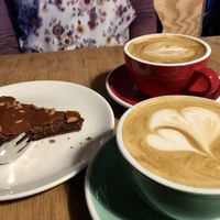 Cappuccino with vegan cake  at 92 Grad in Rostock