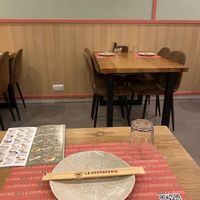 Interior Seating, they have tables and for single riders  at La Uramakeria in Barcelona