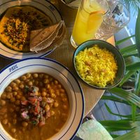 Hummus, chana masala, lemon rice and orange lemonade  at Podil East India Company in Kyiv