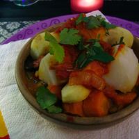 Vegetable tajine with (if remembered correctly) aubergine, potato, parsnip, stewed pear, potato, carrots, tomato, with wheat and lentils on the bottom. at Passion for Food in Bruges