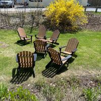 Sunny outdoor seating and forsythias at Grounds in New London