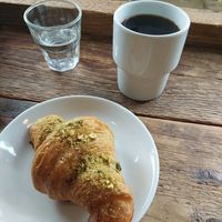 Vegan pistachio croissant and filter coffee. at Moko in Warsaw