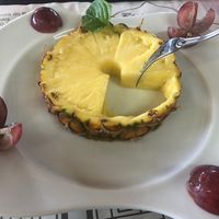 Dessert: pineapple and grapes   at O Branquinho in San Jorge